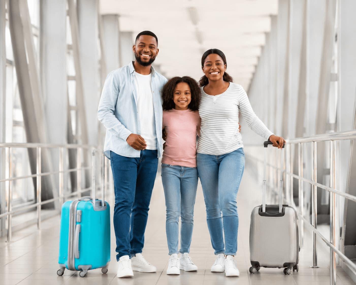 Family travelling with luggage at an airport